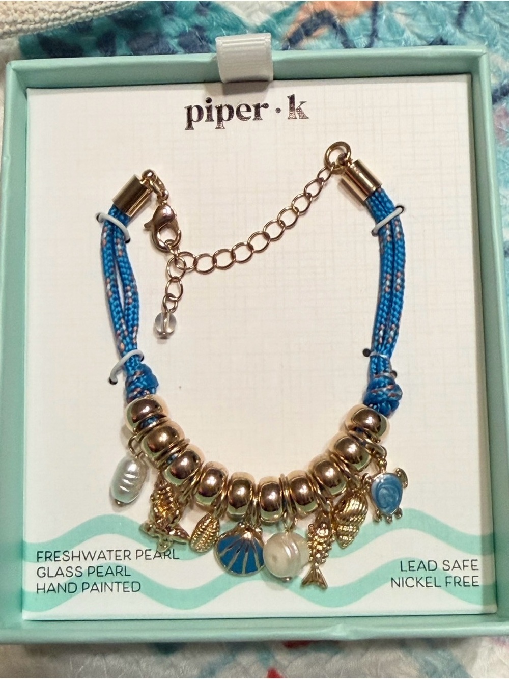 Piper•K Charm Bracelet with Blue Cord, Pearls, Turtle, Fish, Starfish & Shells